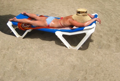 Woman lying on the beach in Palma Nova